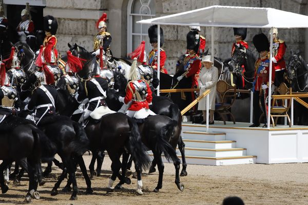 Queen Elizabeth II inspects troops at the ceremony.