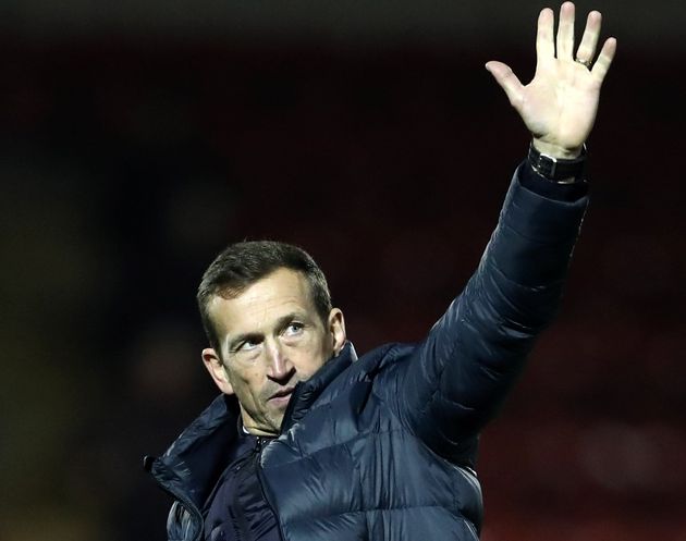 Justin Edinburgh pictured waving at supporters on March 29 this year.