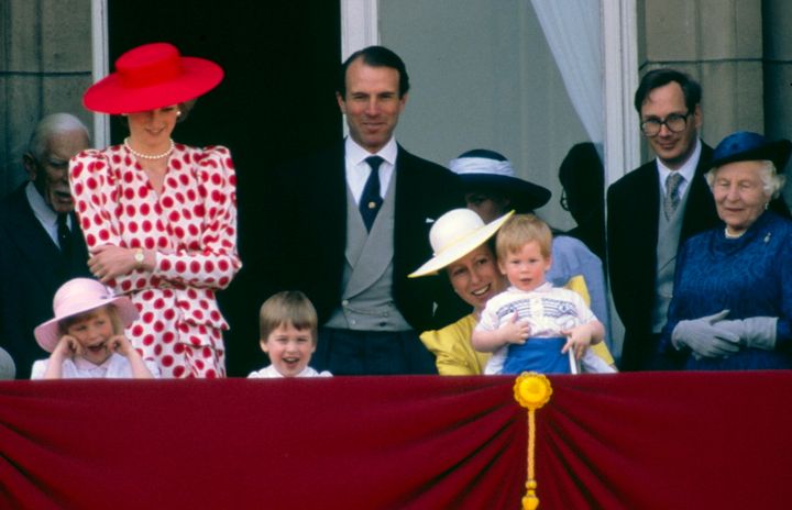 Princess Anne holding Prince Harry after Trooping The Colour in 1986.