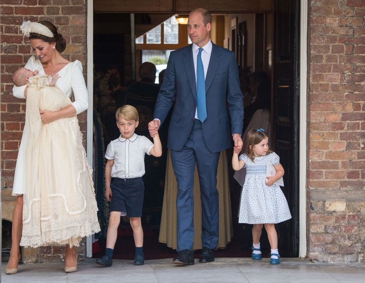 Kate Middleton, Duchess of Cambridge, holds a newly christened Prince Louis on June 20, 2018.