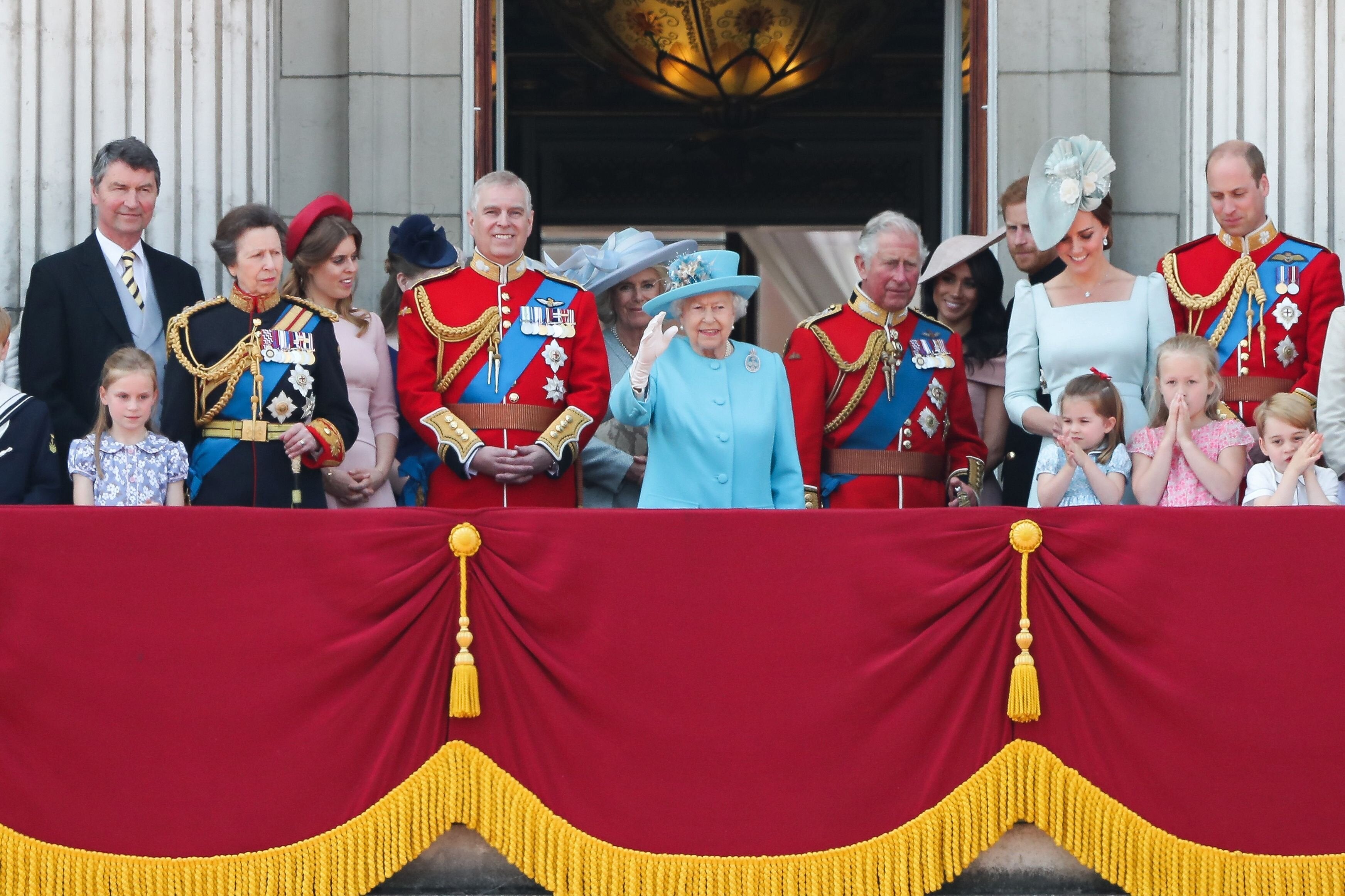 Prince Harry and Meghan Markle pictured standing at the back at the 2018 Trooping the Colour balcony, while Prince Andrew stands next to the Queen