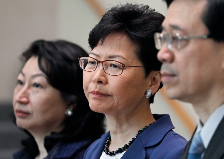 From right, Hong Kong Secretary for Security John Lee, Hong Kong Chief Executive Carrie Lam and Secretary of Justice Teresa Cheng listen to reporters questions during a press conference in Hong Kong on June 10, 2019.