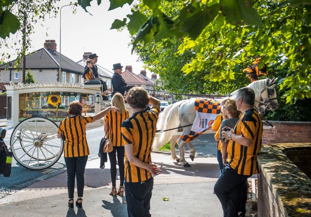 Stanley's twin sister Elsie May sat on top of the horse-drawn hearse carrying his coffin at his funeral last year 