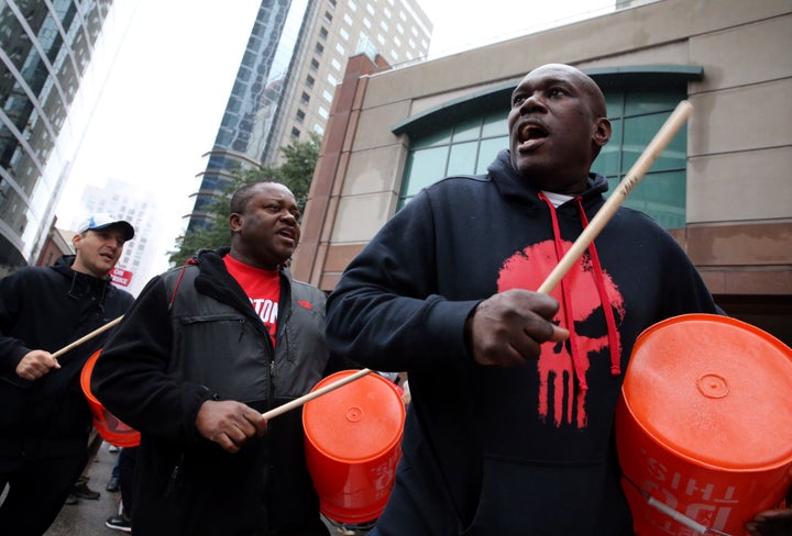 Workers and supporters picket outside the Sheraton Boston by Marriott in Boston on Oct. 3, 2018. The hotel was part of an 8-city strike waged by Unite Here.