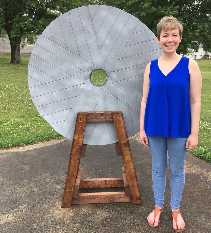 Rev. Ashley Easter stands next to a fake millstone that will be displayed Tuesday at the "For Such a Time as This" rally outside the Birmingham-Jefferson Convention Center in Alabama. It represents Jesus' warning about people who harm children.