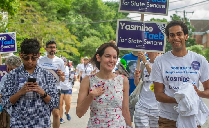 Yasmine Taeb, a human rights attorney challenging Dick Saslaw, talks to constituents in the Memorial Day Parade in Falls Church, Virginia, on May 27.