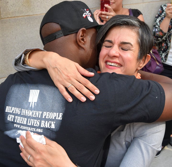 Parisa Dehghani-Tafti, legal director of the Mid-Atlantic Innocence Project, hugs Lamar Johnson, who was released after 13 ye