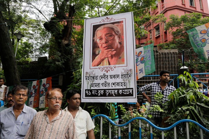 People follow the funeral procession of Mahashweta Devi.