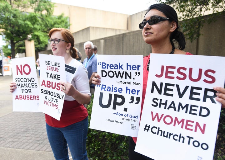 Jennifer Weed, left, and Nisha Virani, both of Birmingham, Ala., demonstrate outside Southern Baptist Convention's annual meeting Tuesday, June 11, 2019, during a rally in Birmingham, Ala. 