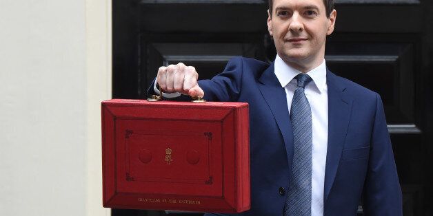 LONDON, ENGLAND - JULY 08: The Chancellor of the Exchequer George Osborne holds his ministerial red box up to the media as he leaves 11 Downing Street on July 8, 2015 in London, England. The Chancellor is presenting his summer budget today to Parliament and is expected to announce Â£12 billion in welfare cuts. (Photo by Stuart C. Wilson/Getty Images)