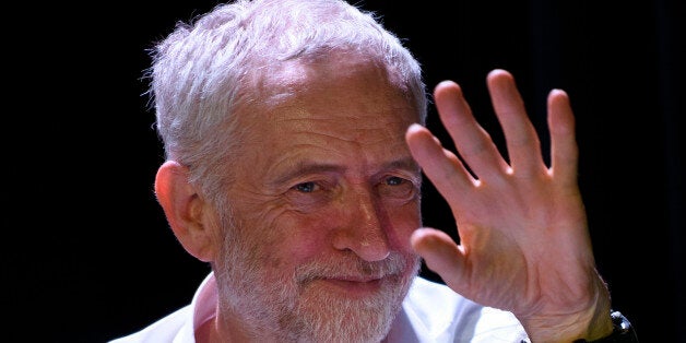 LONDON, ENGLAND - NOVEMBER 04: Labour Leader Jeremy Corbyn listens to speakers during a 'Refugees Welcome Here Rally' at The Camden Centre on November 4, 2015 in London, England. Speaking at a rally hosted by Stand Up To Racism the Labour Leader along with Shadow International Development Secretary Diane Abbot will talk about the delays by European Leaders to reach a political agreement on the number of refugees to be taken in across the EU. (Photo by Ben Pruchnie/Getty Images)