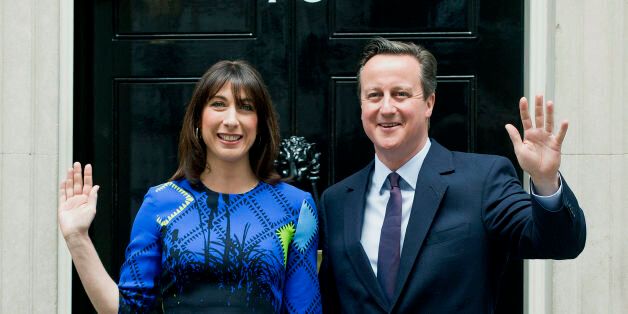 File photo dated 08/05/15 of Prime Minister David Cameron arriving at 10 Downing Street, London, with his wife Samantha, following an audience with Queen Elizabeth II at Buckingham Palace, to confirm his second term as Prime Minister following his party's General Election victory.