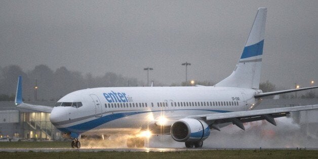 A charter flight carring approximately a hundred Syrian refugees lands at Glasgow airport, Scotland on November 17, 2015. A first flight carrying Syrian refugees to Britain landed in Glasgow today as part of government plans to bring in 20,000 asylum-seekers over the next five years.AFP PHOTO / OLI SCARFF (Photo credit should read OLI SCARFF/AFP/Getty Images)