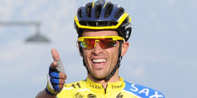 AREZZO, ITALY - MARCH 15: Alberto Contador of Tinkoff Saxo crosses the finish line and wins stage four of the 2014 Tirreno Adriatico, a 244 km stage from Arezzo to Cittareale on March 15, 2014 in Arezzo, Italy. (Photo by Giuseppe Bellini - Velo/Getty Images)