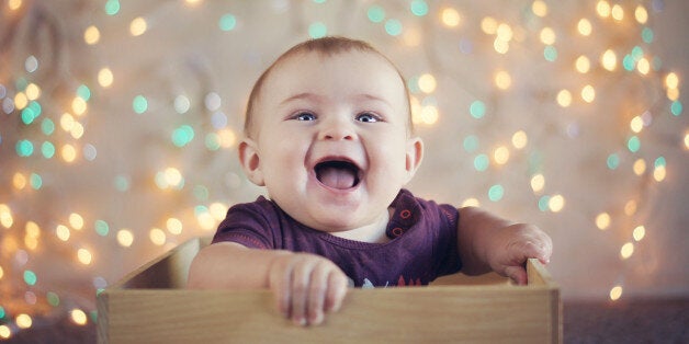 Baby in box with Christmas lights