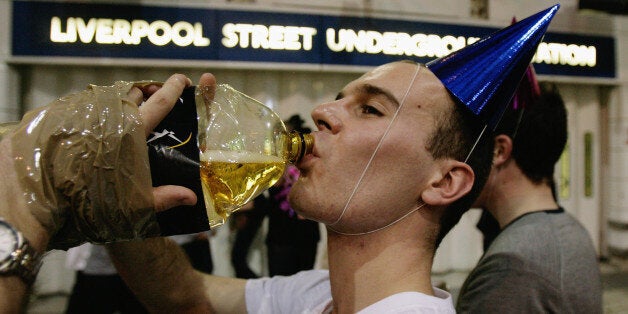 LONDON - MAY 31: Party revellers enjoy the atmosphere as they congregate outside of a closed Liverpool St Tube Station during a Facebook cocktail party on the Circle Line on May 31, 2008 in central London, England. Tonight is the last evening when Londoners can consume alcohol on public transport. The cocktail party, organised on the networking Web site Facebook, attracted thousands of revellers to enjoy one last drink on the London Underground before the ban's enforcement on June 1, 2008. The