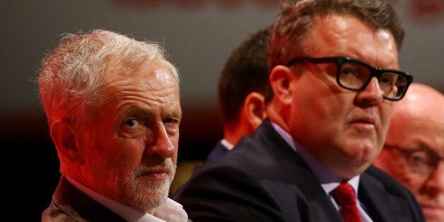 Labour party leader Jeremy Corbyn (left) with deputy leader Tom Watson listening to speeches onstage during the Labour Party annual conference at the Brighton Centre in Brighton, Sussex.