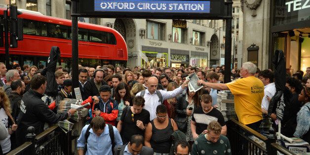 People queue at an entrance to Oxford Circus station, London, as workers try to get home before a strike by Underground workers closes the capital's entire Tube system.