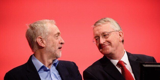 Leader of the opposition Labour Party Jeremy Corbyn (L) speaks with with Shadow Foreign Secretary Hilary Benn on day two of the annual Labour party conference in Brighton on September 28, 2015. AFP PHOTO / LEON NEAL (Photo credit should read LEON NEAL/AFP/Getty Images)