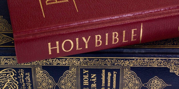 Close-up of the Koran and the Bible