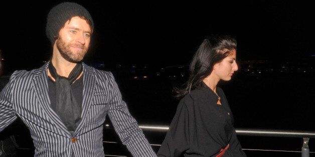 LONDON, UNITED KINGDOM - FEBRUARY 15: Howard Donald and Katie Halil are seen leaving the Brit Awards on February 15, 2011 in London, United Kingdom. (Photo by Bauer-Griffin/GC Images)