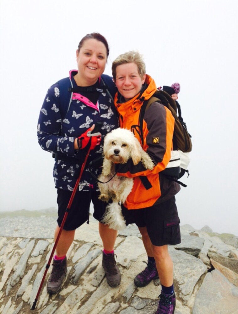 The couple post weight loss with dog Teddy