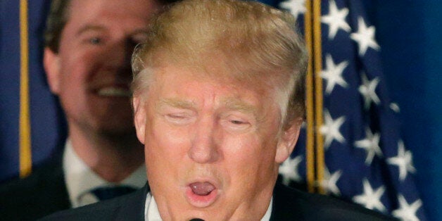 Republican presidential candidate, businessman Donald Trump speaks to supporters during a primary night rally, Tuesday, Feb. 9, 2016, in Manchester, N.H. (AP Photo/David Goldman)