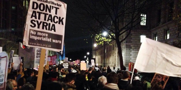 Thousands of people protest against military intervention in Syria near Parliament Square in London.