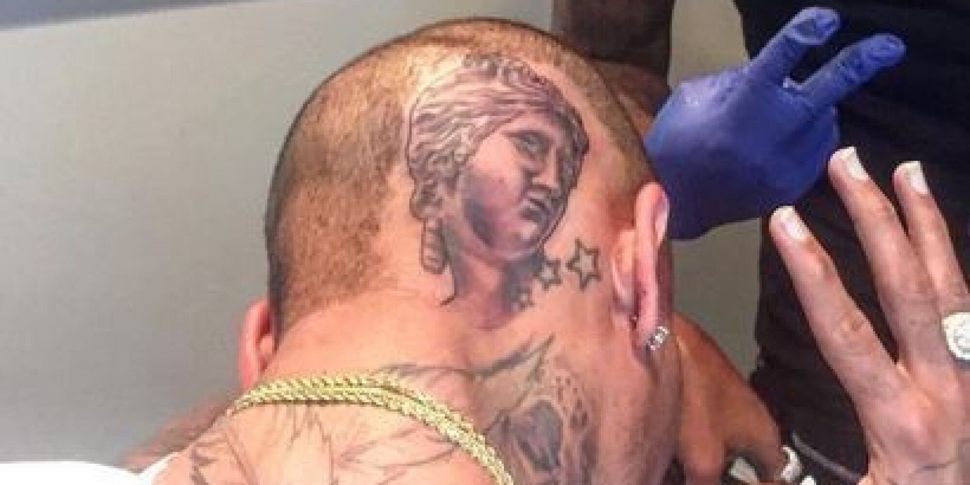 Buddha inspired tattoo located on Chris Brown's hand.
