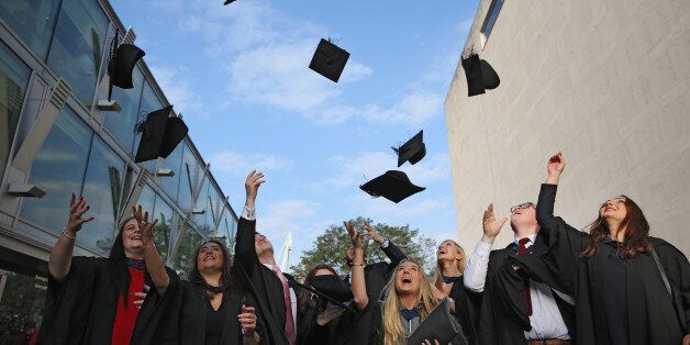 Students celebrate their graduation. Under news plans from Plaid Cymru Welsh graduates would be eligible to have £6,000 wiped off their student debts every year.