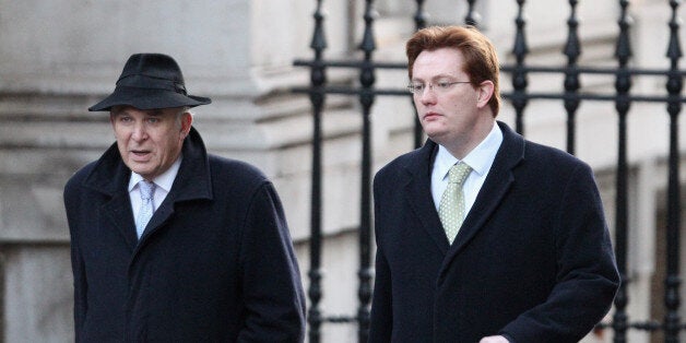 LONDON, ENGLAND - DECEMBER 13: Vince Cable (L), the Business Secretary, and Danny Alexander, the Chief Secretary to the Treasury, arrive in Downing Street to attend the weekly Cabinet meeting on December 13, 2011 in London, England. Senior Conservatives and Liberal Democrats will likely discuss Prime Minster David Cameron's decision to implement the UK's veto at a recent EU summit; a move which was heavily criticised by the pro-European Deputy Prime Minister. (Photo by Oli Scarff/Getty Images)