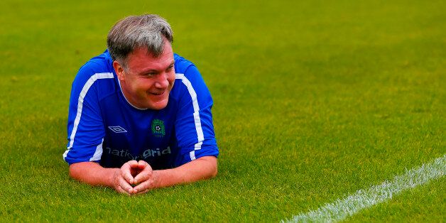 Ed Balls on the pitch after stumbling during the MPs vs lobby journalists football match