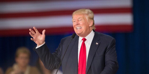 DUBUQUE, IA - AUGUST 25: Republican presidential candidate Donald Trump speaks to guests gathered for a campaign event at the Grand River Center on August 25, 2015 in Dubuque, Iowa. Trump leads most polls in the race for the Republican presidential nomination. (Photo by Scott Olson/Getty Images)