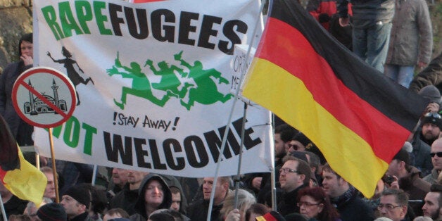 Right-wing demonstrators hold a sign