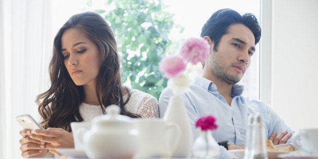 Couple arguing in restaurant