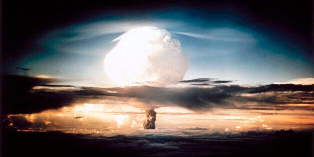 The mushroom cloud produced by the first explosion by the Americans of a hydrogen bomb at Eniwetok Atoll in the South Pacific. Known as Operation Ivy, this test represented a major step forwards in terms of the destructive power achievable with atomic weapons. The hydrogen, or fusion, bomb used a fission device similar to those dropped on Hiroshima and Nagasaki at the end of World War II, detonated inside a container containing deuterium. The high temperatures invol