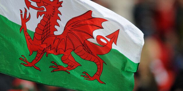 A Wales flag flies in the stands.