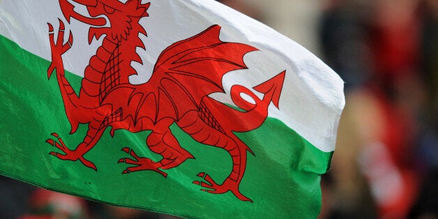 A Wales flag flies in the stands.