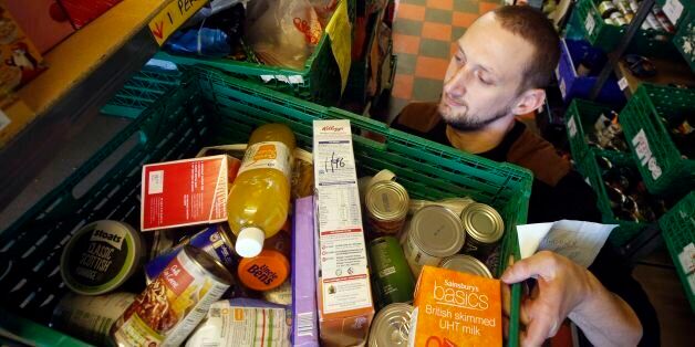 Kyle McCormick at a Trussell Trust foodbank in Blawarthill Parish Church, Glasgow, as anti-poverty charities are calling on the Scottish Government and employers to do more to help families avoid crisis in a new report on foodbank use.