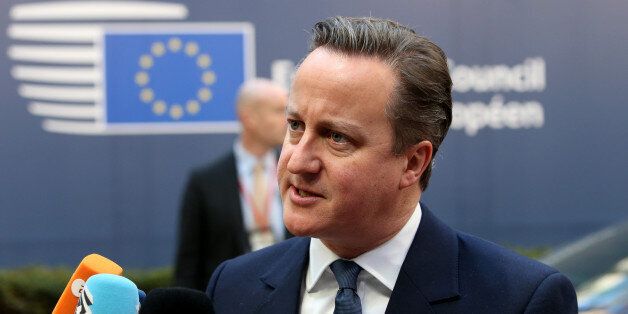 British Prime Minister David Cameron speaks with the media as he arrives for an EU summit at the EU Council building in Brussels on Friday, Feb. 19, 2016. British Prime Minister David Cameron faces tough new talks with European partners after through-the-night meetings failed to make much progress on his demands for a less intrusive European Union. (AP Photo/Francois Walschaerts)