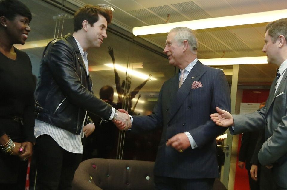 Britain's Prince Charles meets Radio1 presenter Nick Grimshaw during a visit to the BBC at New Broadcasting House in London