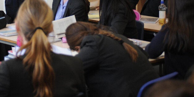 Undated file photo of a lesson being taught a a school. Teachers are facing physical violence in the classroom, with pupils kicking, punching, spitting and even using weapons in school, according to a survey.