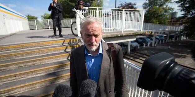 STEVENAGE, ENGLAND - AUGUST 25: Labour leadership candidate Jeremy Corbyn (L) speaks to the media as he leaves a radio hustings on August 25, 2015 in Stevenage, England. Candidates are continuing to campaign for Labour party leadership with polls placing left-winger Jeremy Corbyn in the lead with the results due to be announced on September 12. (Photo by Carl Court/Getty Images)