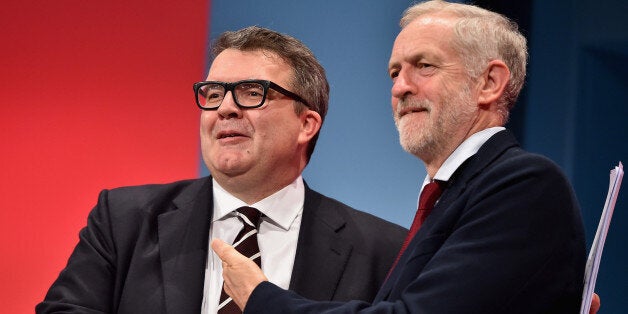 BRIGHTON, ENGLAND - SEPTEMBER 30: Deputy Leader of the Labour party Tom Watson takes applause with Labour Leader Jeremy Corbyn following his closing speech on the final day of the Labour Party Autumn Conference on September 30, 2015 in Brighton, England. On the fourth and final day of the annual Labour Party Conference, delegates will debate and vote on an emergency motion detailing strict conditions for the support of military action in Syria, as well as attending talks on healthcare and educa