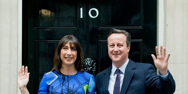 File photo dated 08/05/15 of Prime Minister David Cameron arriving at 10 Downing Street, London, with his wife Samantha, following an audience with Queen Elizabeth II at Buckingham Palace, to confirm his second term as Prime Minister following his party's General Election victory.