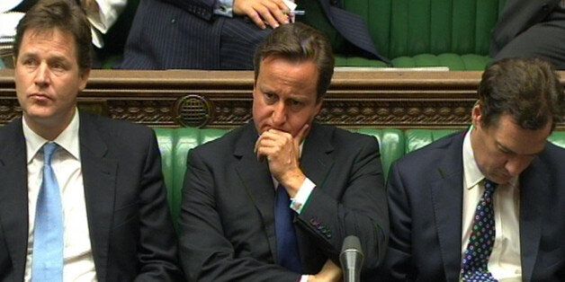Prime Minister David Cameron, Deputy Prime Minister Nick Clegg (left) and Chancellor George Osborne (right) react during Prime Minister's Questions in the House of Commons, London.