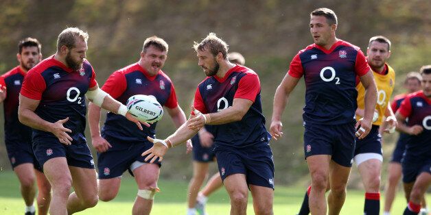 BAGSHOT, ENGLAND - SEPTEMBER 08: Chris Robshaw offloads the ball to team mate James Haskell during the England training session held at Pennyhill Park on September 8, 2015 in Bagshot, England. (Photo by David Rogers/Getty Images)