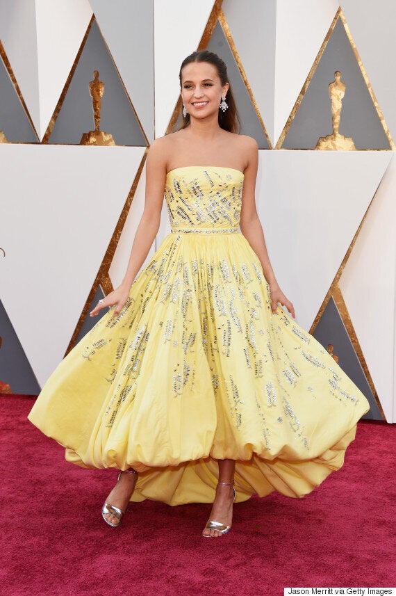 Alicia Vikander on stage at the 2016 Oscars wearing Louis Vuitton