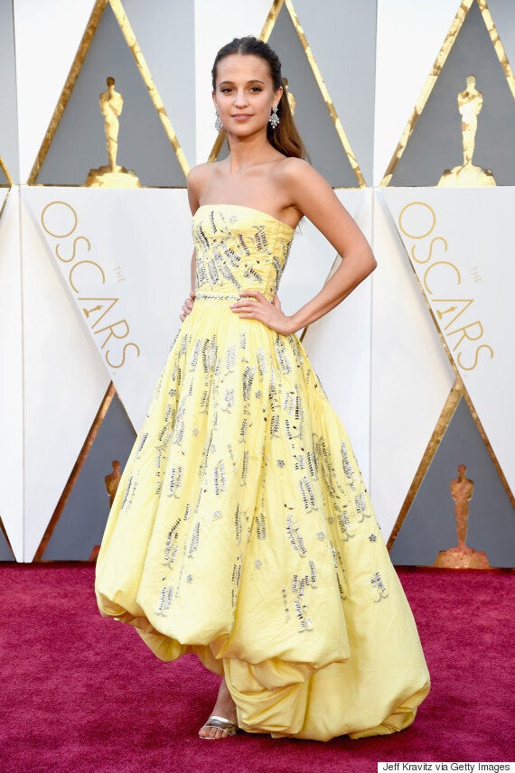 Alicia Vikander on stage at the 2016 Oscars wearing Louis Vuitton