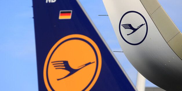 The Deutsche Lufthansa AG logo sits on the wing and tailfin of an Airbus A320neo aircraft during a delivery ceremony outside the Airbus Group SE factory in Hamburg, Germany, on Friday, Feb. 12, 2016. Lufthansa, the sole airline so far to take delivery of the new A320neo model, will limit the plane to domestic German routes until glitches with the engine cooling system are resolved in coming weeks. Photographer: Krisztian Bocsi/Bloomberg via Getty Images